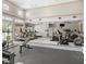 Community fitness center offering treadmills, ellipticals, and weight machines in a well-lit and spacious setting at 11713 Goldenrod Ave, Bradenton, FL 34212