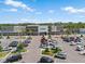 Bright aerial view of Publix grocery store featuring a spacious parking lot and various storefronts nearby at 11713 Goldenrod Ave, Bradenton, FL 34212