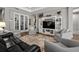 Comfortable living area with plush seating, entertainment center, and neutral color palette at 11713 Goldenrod Ave, Bradenton, FL 34212