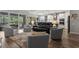 Open-concept living space with a seamless flow between the living room, dining area, and kitchen with a sliding glass door at 11713 Goldenrod Ave, Bradenton, FL 34212