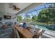 The screened lanai with a spacious dining area overlooks a beautiful pool, ideal for outdoor entertaining at 11713 Goldenrod Ave, Bradenton, FL 34212