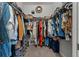 Spacious walk-in closet with ample hanging space, shelving, and various storage solutions at 11713 Goldenrod Ave, Bradenton, FL 34212