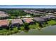Beautiful aerial view of the community with ponds and lush green landscaping and tile roofs at 12012 Legacy Estates Blvd, Sarasota, FL 34238