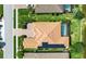 Home showcasing a screened-in pool, solar panels, and brick-paved driveway at 12012 Legacy Estates Blvd, Sarasota, FL 34238