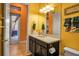 Bathroom with elegant vanity, framed mirror, decorative towels and doorway leading to the deck at 12012 Legacy Estates Blvd, Sarasota, FL 34238