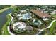 Aerial view of community pool and clubhouse with playground and lush landscaping at 12012 Legacy Estates Blvd, Sarasota, FL 34238