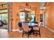 Cozy breakfast nook features a built-in bench, a table, and a large window with views of the outdoors at 12012 Legacy Estates Blvd, Sarasota, FL 34238