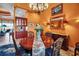 Cozy dining area with wood table, stylish chairs, and built-in cabinets visible in adjacent room at 12012 Legacy Estates Blvd, Sarasota, FL 34238