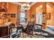 Bright dining room with a round table, large windows, and eye-catching decor at 12012 Legacy Estates Blvd, Sarasota, FL 34238