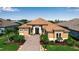 Appealing home featuring manicured landscaping and a brick paver driveway at 12012 Legacy Estates Blvd, Sarasota, FL 34238
