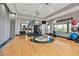 Modern gym features fitness equipment, free weights, and an exercise mat, and large windows at 12012 Legacy Estates Blvd, Sarasota, FL 34238