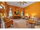 Spacious living room with large windows and comfortable seating, filled with natural light at 12012 Legacy Estates Blvd, Sarasota, FL 34238