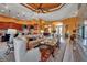 Bright and open living area featuring tile floors, comfortable seating, and an integrated kitchen at 12012 Legacy Estates Blvd, Sarasota, FL 34238