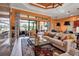 Beautiful living room featuring tile floors, neutral furniture, and bright natural light at 12012 Legacy Estates Blvd, Sarasota, FL 34238