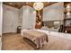 Bright massage room with hardwood floors, sink, modern lighting, wood shelving, and stylish furnishings at 12012 Legacy Estates Blvd, Sarasota, FL 34238