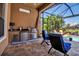 Outdoor kitchen features stainless steel appliances, sink, and plenty of counter space for entertaining at 12012 Legacy Estates Blvd, Sarasota, FL 34238