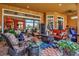Extensive screened lanai features seating and dining areas, with views of the lake and outdoor kitchen at 12012 Legacy Estates Blvd, Sarasota, FL 34238