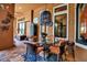 Enclosed patio with glass top table, four chairs, and colorful decorative accents at 12012 Legacy Estates Blvd, Sarasota, FL 34238