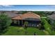 Aerial view of private pool with screen enclosure in the well maintained backyard at 12012 Legacy Estates Blvd, Sarasota, FL 34238
