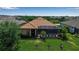 Aerial view of private pool with screen enclosure in the well maintained backyard at 12012 Legacy Estates Blvd, Sarasota, FL 34238