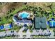 Overhead shot of community amenities including swimming pool, tennis courts, and ample parking at 12291 Myrtle Bay Ct, Sarasota, FL 34238