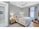 Cozy bedroom with neutral tones, carpeted floors, and a decorative ceiling fan at 12291 Myrtle Bay Ct, Sarasota, FL 34238