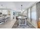 Open-concept living space with dining table, seamlessly connecting kitchen and living areas at 12291 Myrtle Bay Ct, Sarasota, FL 34238