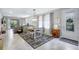 Beautiful dining room with pendant lighting, large windows, tiled floor and stylish decor at 12291 Myrtle Bay Ct, Sarasota, FL 34238