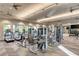 Well-equipped gym featuring modern cardio machines, weightlifting equipment, and mirrored walls at 12291 Myrtle Bay Ct, Sarasota, FL 34238