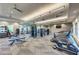 Community fitness center with modern exercise equipment, herringbone floors and ceiling fans at 12291 Myrtle Bay Ct, Sarasota, FL 34238
