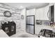 Well-appointed kitchen with stainless steel appliances, white cabinetry, and stylish decor at 12291 Myrtle Bay Ct, Sarasota, FL 34238
