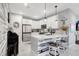 Beautiful kitchen features an island with seating, stainless appliances, and modern finishes at 12291 Myrtle Bay Ct, Sarasota, FL 34238
