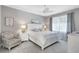 Serene main bedroom with white furniture, neutral tones, and soft natural light at 12291 Myrtle Bay Ct, Sarasota, FL 34238