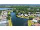 Stunning aerial view of home with screened pool on waterfront lot at 12339 Hollybush Ter, Lakewood Ranch, FL 34202