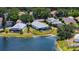 Aerial shot of home with screened pool overlooking lake at 12339 Hollybush Ter, Lakewood Ranch, FL 34202