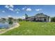 Expansive backyard with screened pool and scenic lake view at 12339 Hollybush Ter, Lakewood Ranch, FL 34202