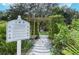 A butterfly garden with educational signage and lush plants for community enjoyment and learning at 12339 Hollybush Ter, Lakewood Ranch, FL 34202