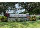 A welcoming Summerfield Park community sign is enhanced by colorful landscaping at the entrance at 12339 Hollybush Ter, Lakewood Ranch, FL 34202