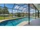 Sparkling screened pool with lake views and outdoor living at 12339 Hollybush Ter, Lakewood Ranch, FL 34202