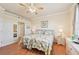 Light-filled bedroom showcasing twin beds and wood-look floors at 12640 Felice Dr, Venice, FL 34293