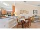 Open kitchen with granite countertops, wooden cabinets, and stainless steel appliances at 12640 Felice Dr, Venice, FL 34293