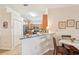 Open kitchen featuring granite countertops and wooden cabinetry with stainless steel appliances at 12640 Felice Dr, Venice, FL 34293