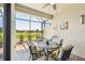 Screened lanai with outdoor seating and a serene water view at 12640 Felice Dr, Venice, FL 34293