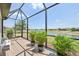 Spacious screened lanai offering beautiful lake views and seating at 12640 Felice Dr, Venice, FL 34293