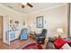 Comfortable living room with hardwood floors, fan, and neutral walls at 12640 Felice Dr, Venice, FL 34293