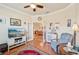 Comfortable living room featuring wood floors, ample seating, and stylish decor at 12640 Felice Dr, Venice, FL 34293