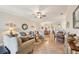 Open-concept living space with tile floors, fan, and natural light at 12640 Felice Dr, Venice, FL 34293