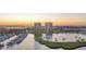 Scenic waterfront condos with a marina and serene lake view at sunset at 130 Riviera Dunes Way # 903, Palmetto, FL 34221