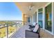 Wide balcony featuring seating area and beautiful views of the surrounding landscape at 130 Riviera Dunes Way # 903, Palmetto, FL 34221