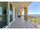 Spacious tiled balcony with glass railings, offering stunning panoramic views at 130 Riviera Dunes Way # 903, Palmetto, FL 34221